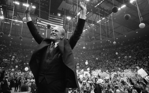Gerald R. Ford cheering in front of a crowd